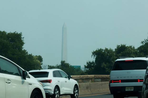 Smoke from Canadian wildfires clouds the National Mall and monuments in Washington