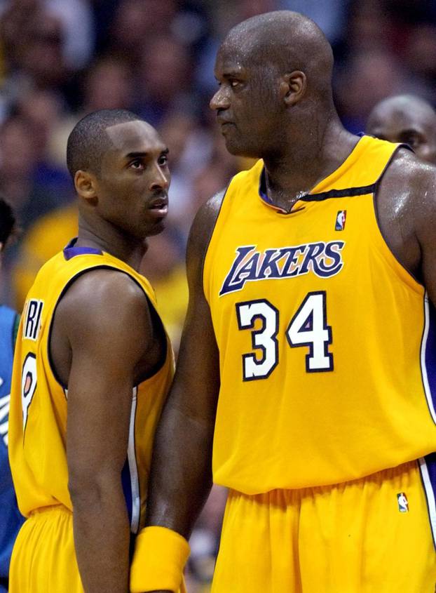FILE PHOTO: LAKERS KOBE BRYANT AND SHAQUILLE ONEAL SHARE A MOMENT AGAINST MINNESOTA TIMBERWOLVES DURING GAME 3.