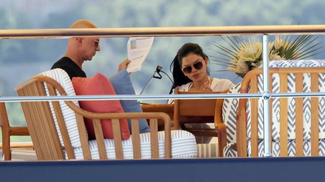 *EXCLUSIVE* The Amazon Billionaire Jeff Bezos pictured out in the Italian sunshine, mixing a little business and pleasure by working hard on his laptop, spotted with his partner Lauren Sanchez on holiday in Capri.