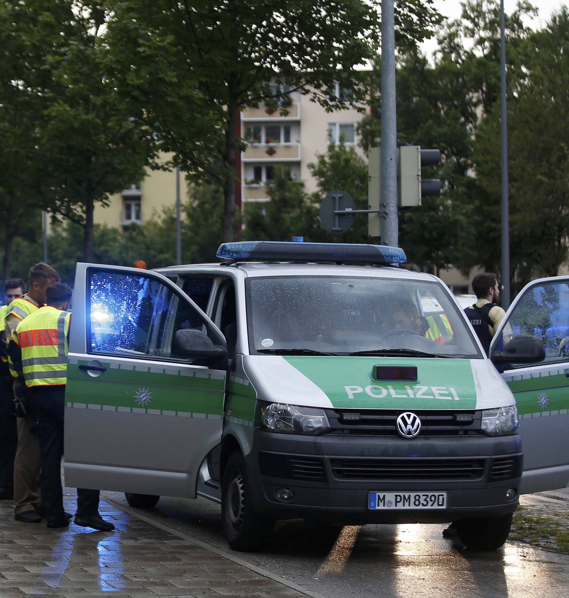 Police secure a street near to the scene of a shooting in Munich