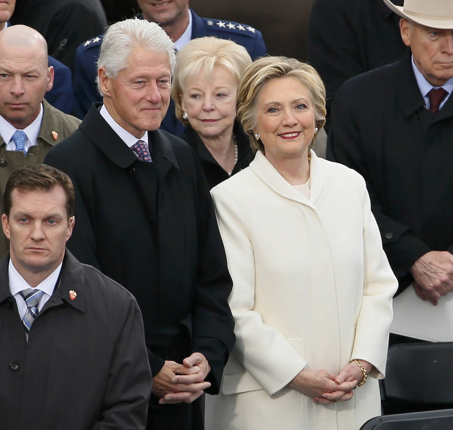 Former Secretary of State Hillary Clinton arrives with her husband former President Bill Clinton during inauguration ceremonies in Washington