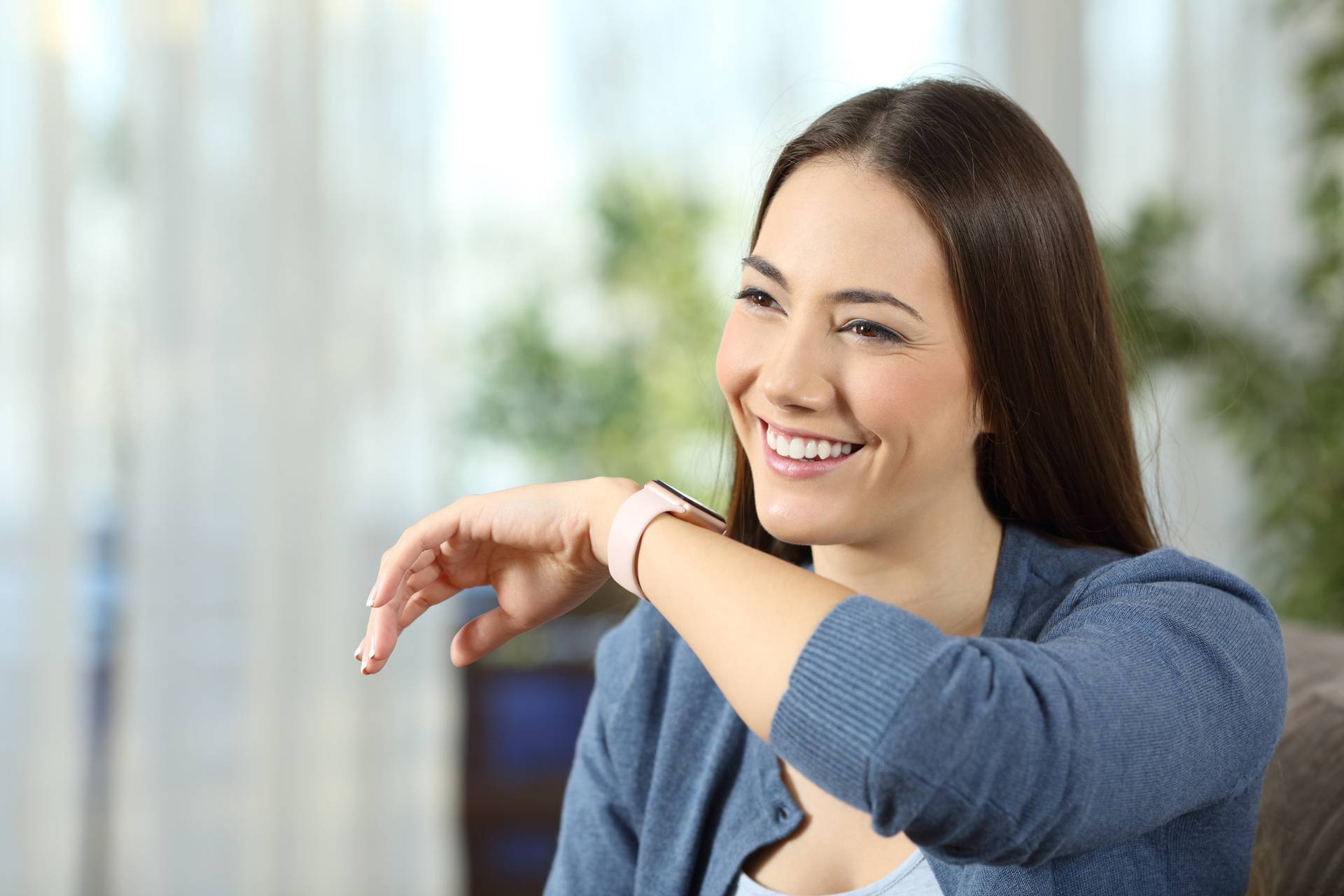 Woman talking to a smartwatch