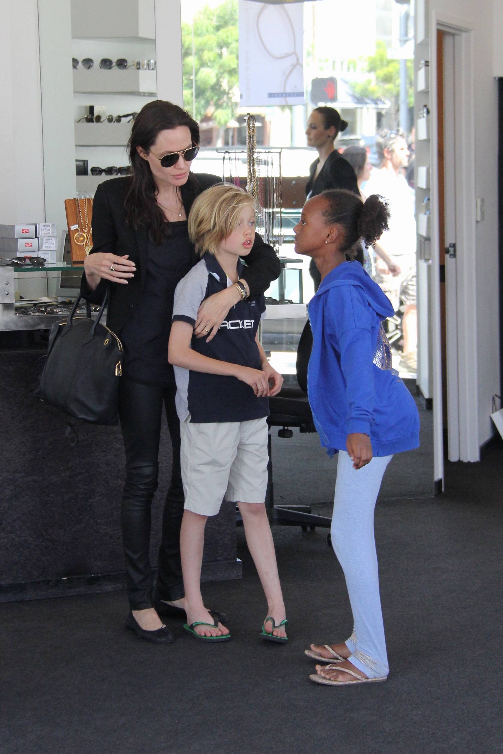 EXCLUSIVE Angelina Jolie goes shopping for sunglasses at Optometrix with two of her children, Shiloh and Zahara Jolie-Pitt