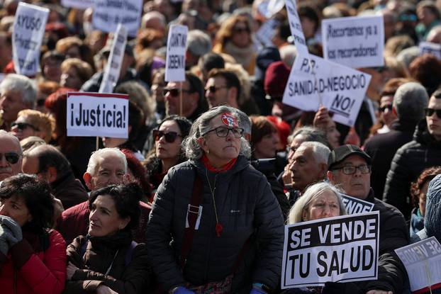 Primary health workers and residents protest against the public health care policy of the Madrid regional government, which they say is destroying primary care, in Madrid