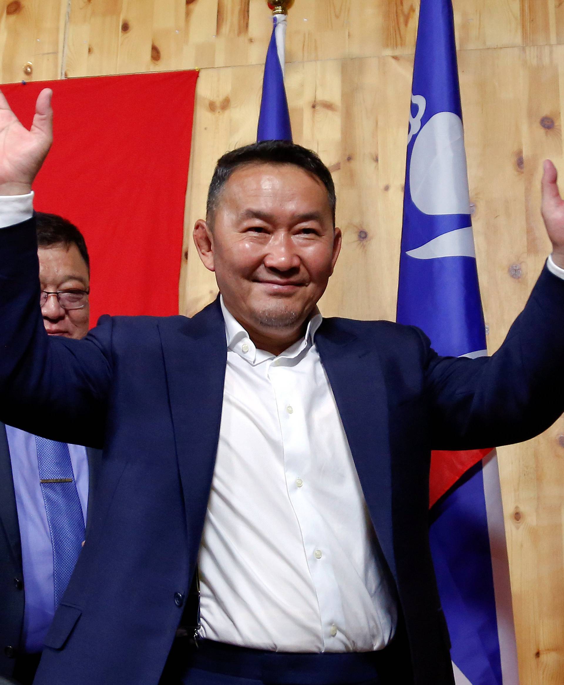 Khaltmaa Battulga, the presidential candidate of the opposition Democratic Party waves to reporters after addressing them in Ulaanbaatar