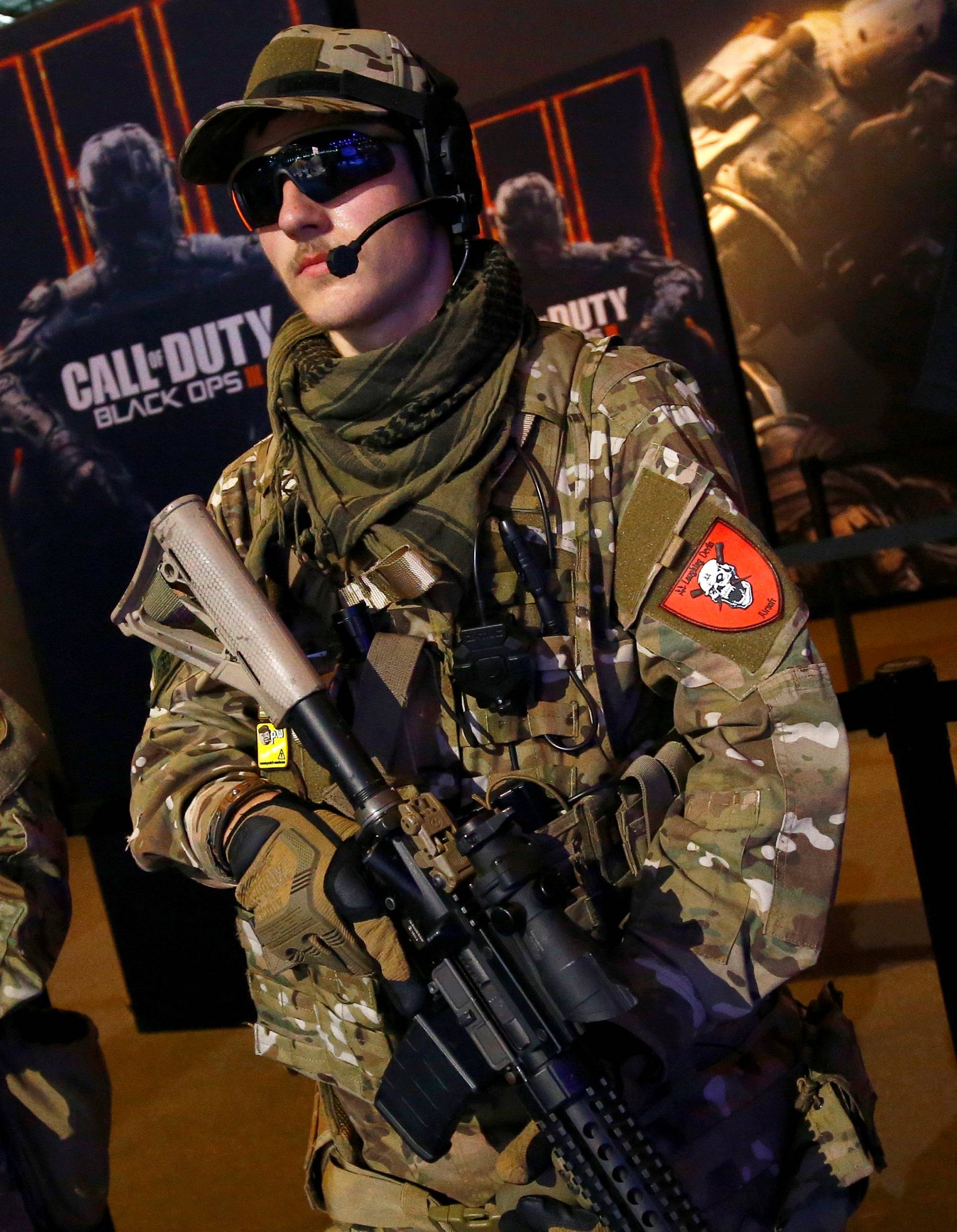 Men are dressed as soldiers to promote the video game "Call Of Duty Black Ops 3" at the Gamescom fair in Cologne