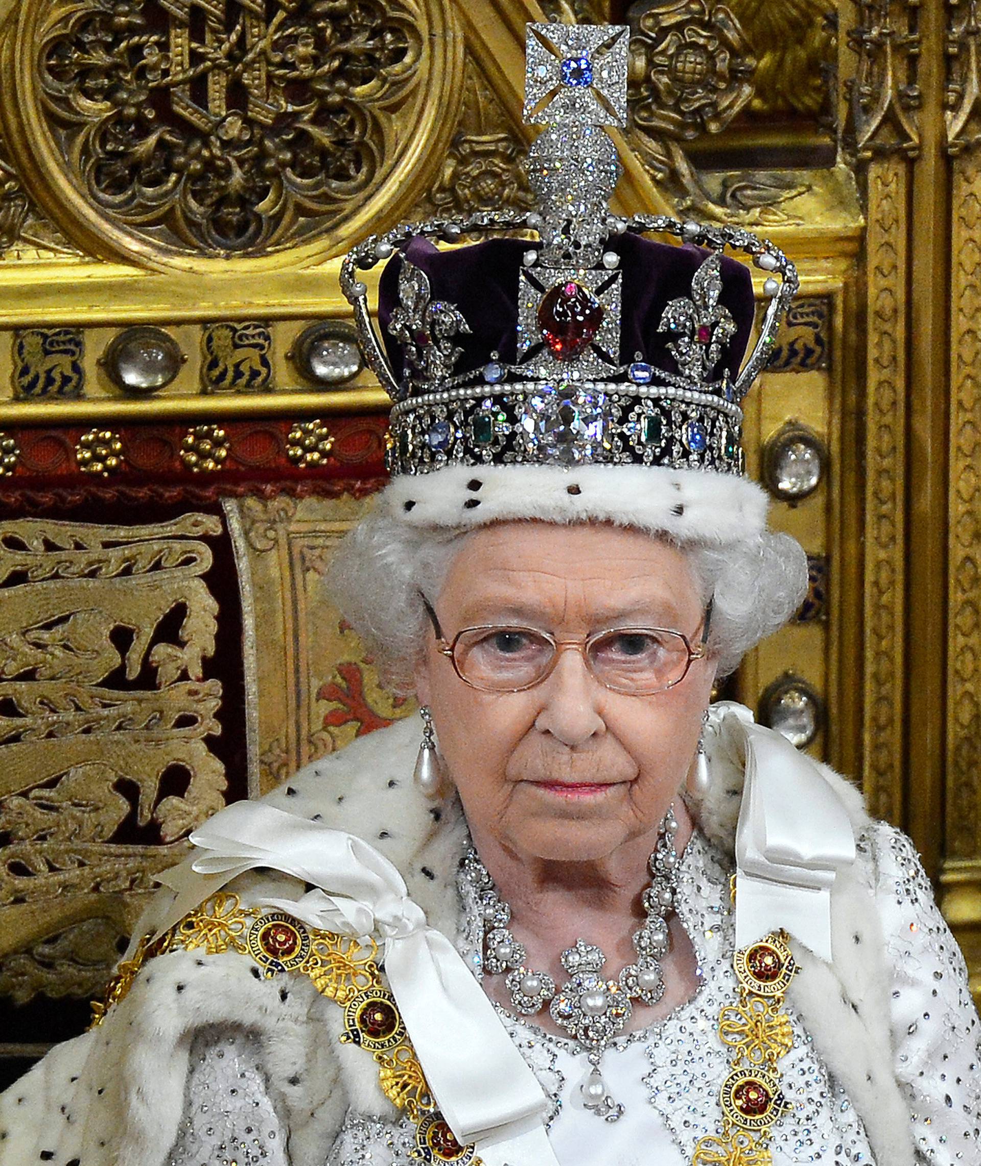 FILE PHOTO: Britain's Queen Elizabeth waits before delivering her speech in the House of Lords, during the State Opening of Parliament at the Palace of Westminster in London