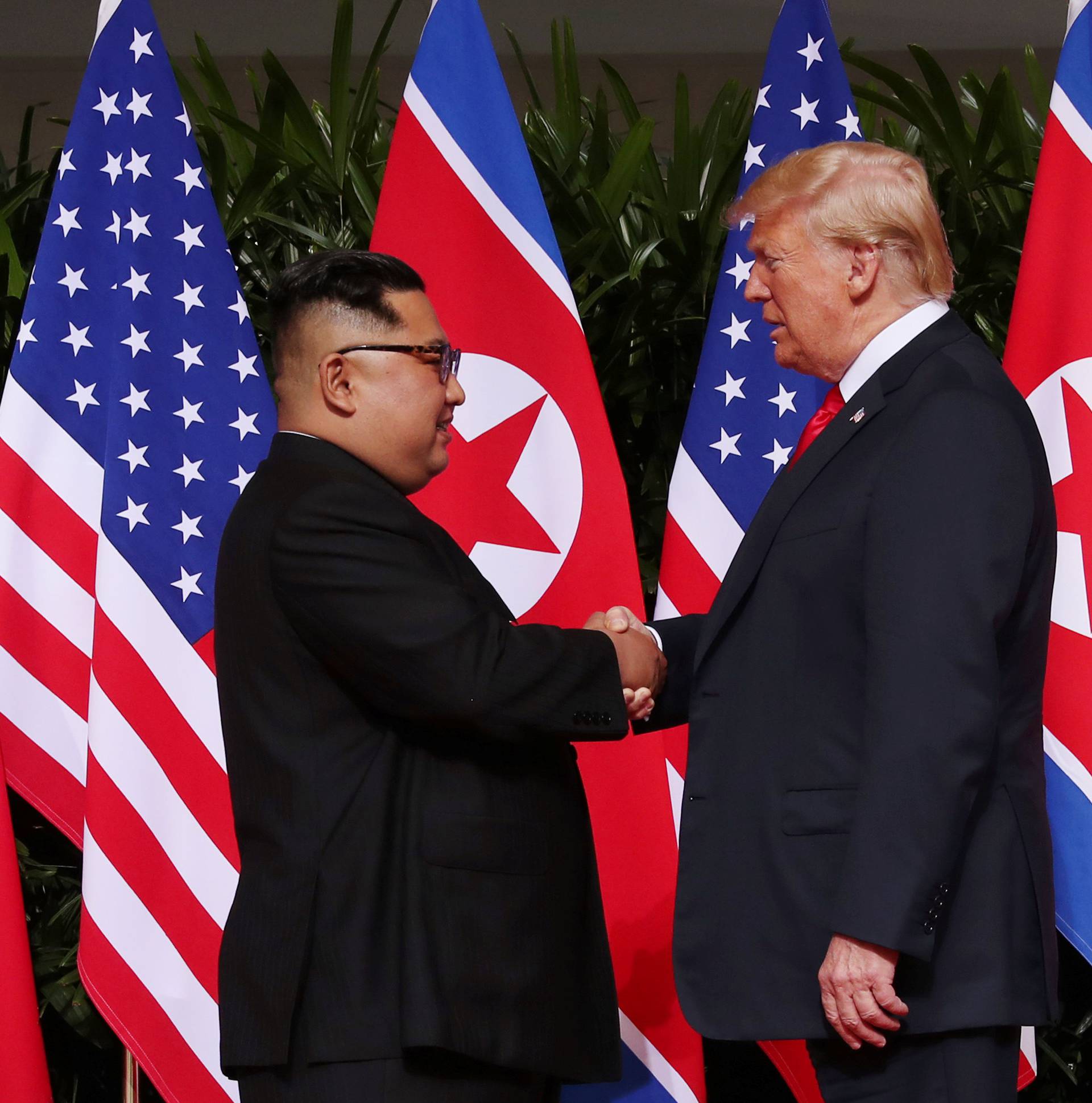 U.S. President Donald Trump shakes hands with North Korean leader Kim Jong Un at the Capella Hotel on Sentosa island in Singapore