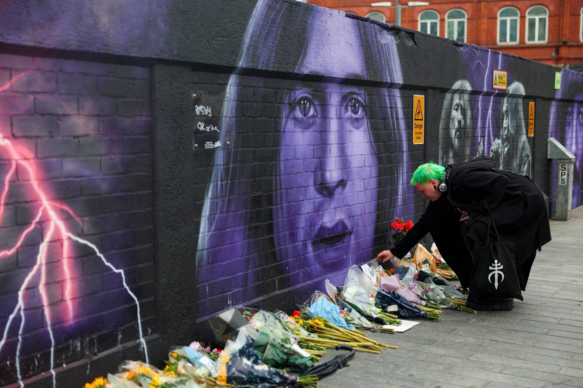 Fans pay tribute following the death of Ozzy Osbourne, in Birmingham