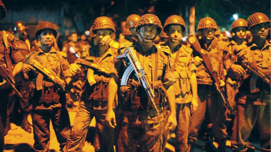 Bangladesh Border Guards are seen near Gulshan restaurant following a gunmen attack in Dhaka