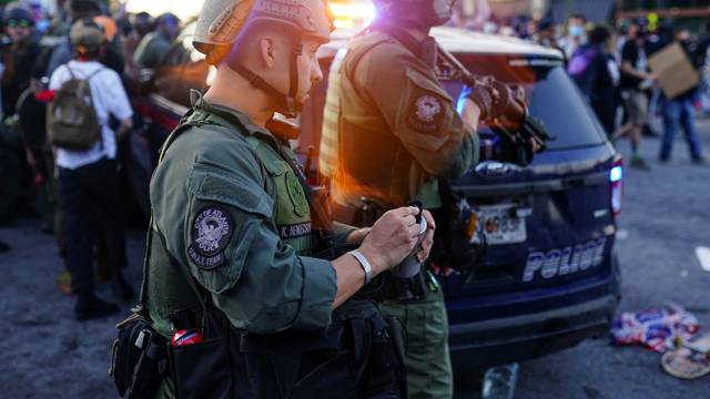 Atlanta SWAT officers are seen with weapons out during a rally against racial inequality and the police shooting death of Rayshard Brooks, in Atlanta