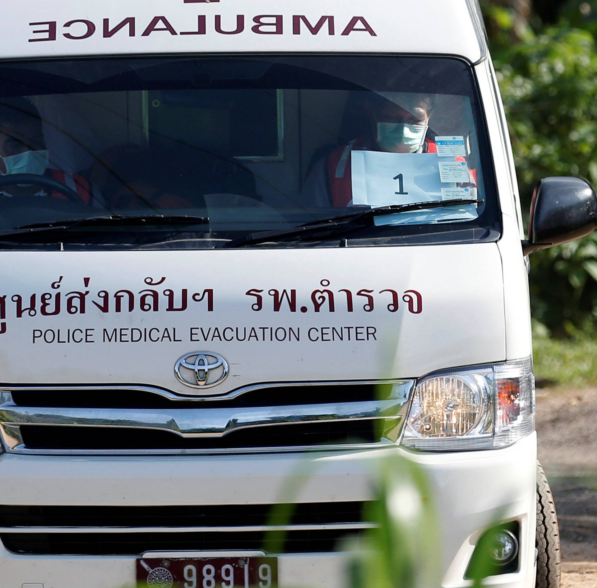 An ambulance believed to be carrying rescued schoolboys leaves from Tham Luang cave complex in the northern province of Chiang Rai