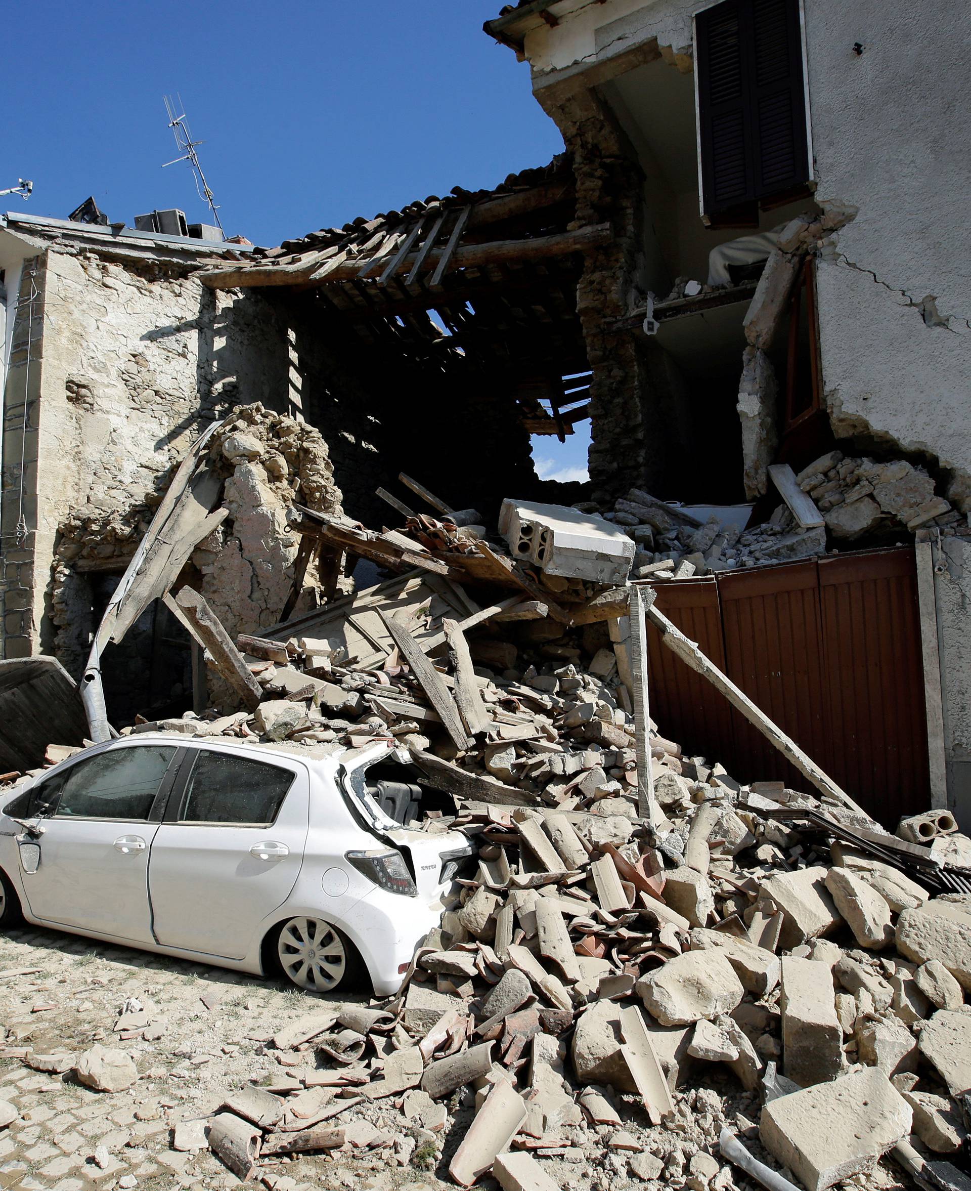 Collapsed buildings are seen following an earthquake at Castel Sant'Angelo near Amatrice