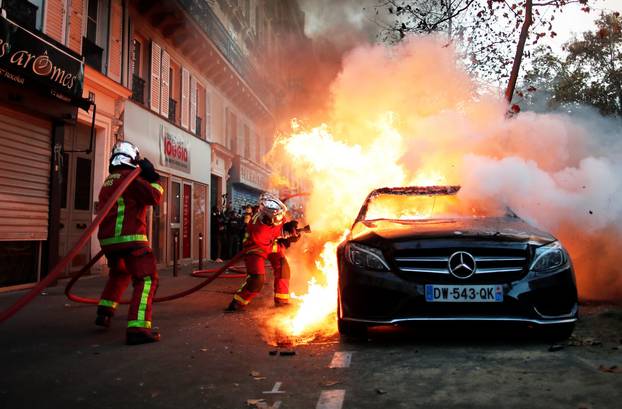 Protests over proposed curbs on identifying police, in Paris