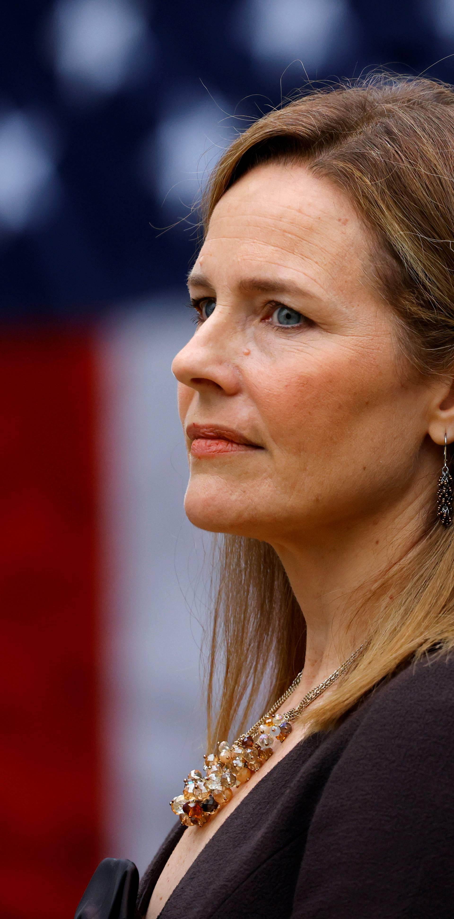 U.S. Court of Appeals for the Seventh Circuit Judge Amy Coney Barrett stands as U.S President Donald Trump holds an event to announce her nomination for the Supreme Court at the White House in Washington