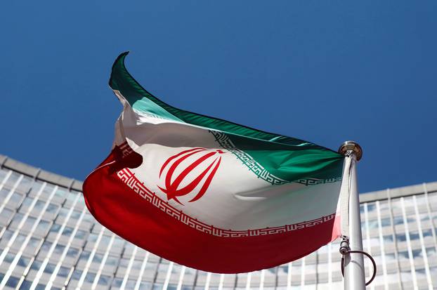 FILE PHOTO: An Iranian flag flutters in front of the UN headquarters in Vienna