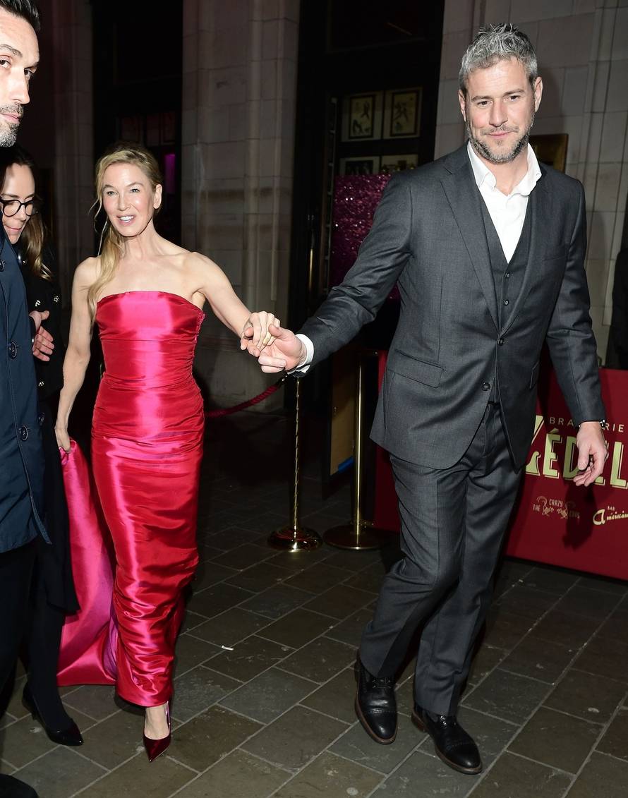 American Actress Renee Zellweger looks in great spirits with her boyfriend Ant Anstead while departing the Bridget Jones: Mad About The Boy afterparty in London.