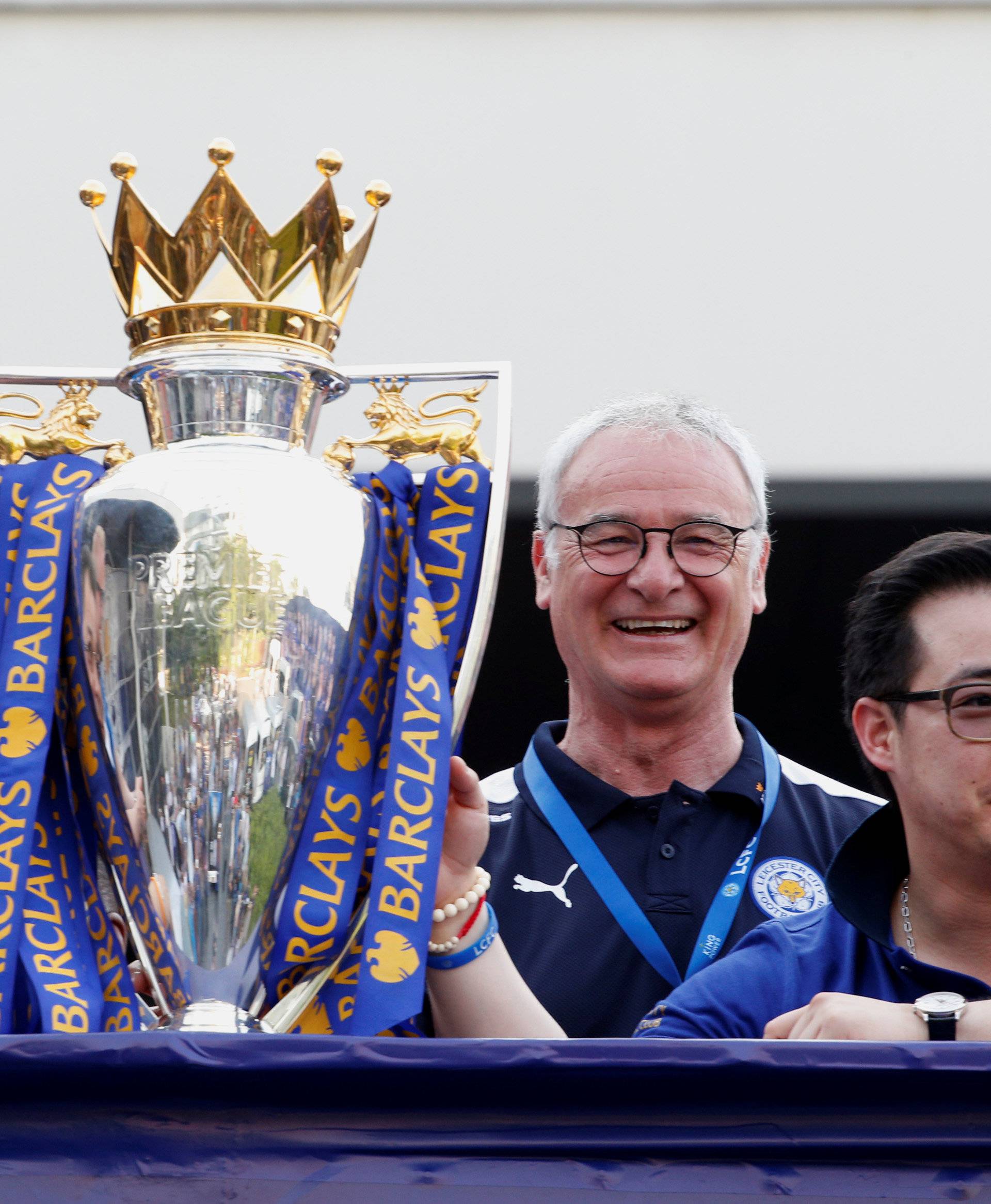 Leicester City soccer club's team owner Vichai Srivaddhanaprabha, manager Claudio Ranieri and club's vice chairman Aiyawatt Srivaddhanaprabha are seen during a parade in Bangkok