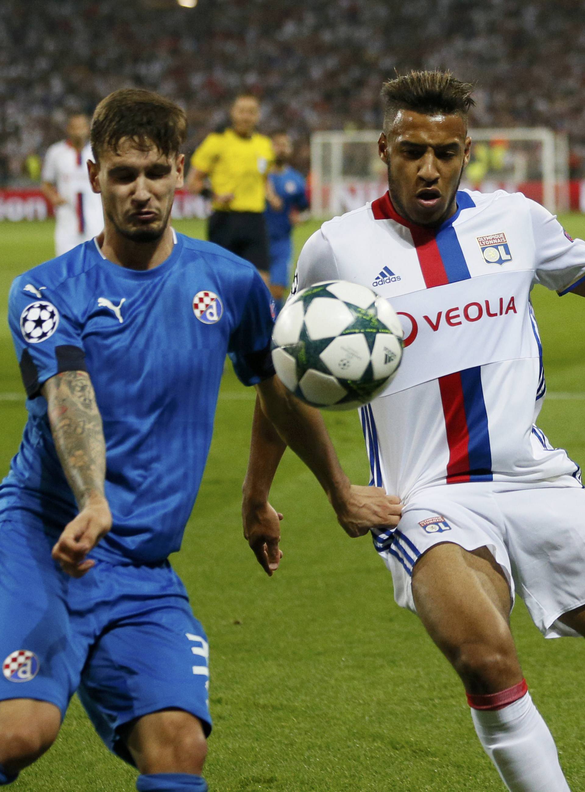 Dinamo Zagreb's Petar Stojanovic in action with Olympique Lyon's Corentin Tolisso