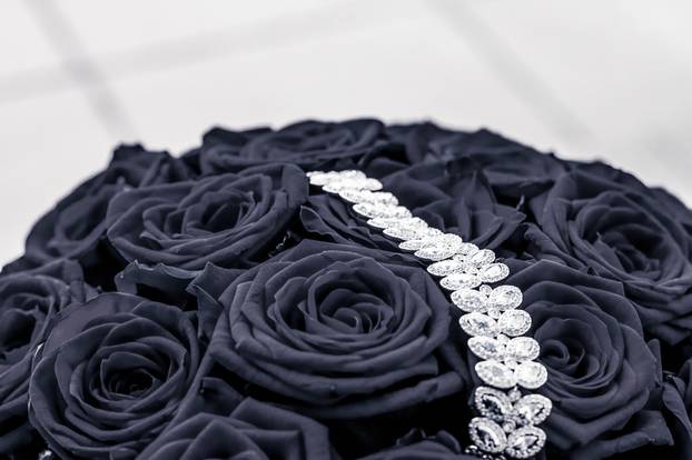 Luxury diamond jewelry bracelet and black roses flowers, love gi