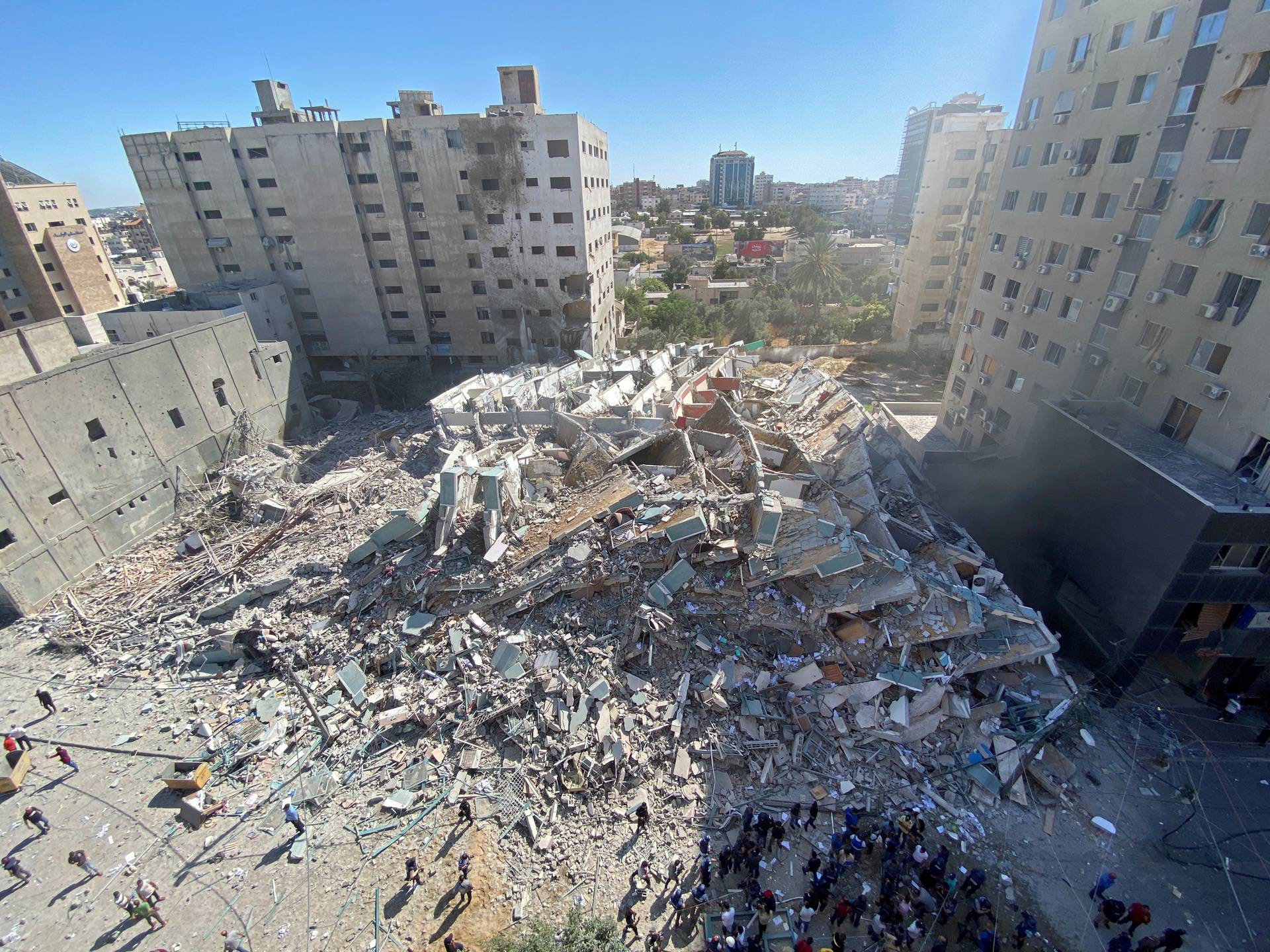 A tower housing AP, Al Jazeera offices collapses after Israeli missile strikes in Gaza city