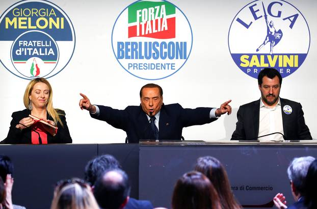 Forza Italia leader Silvio Berlusconi speaks flanked by Fratelli D
