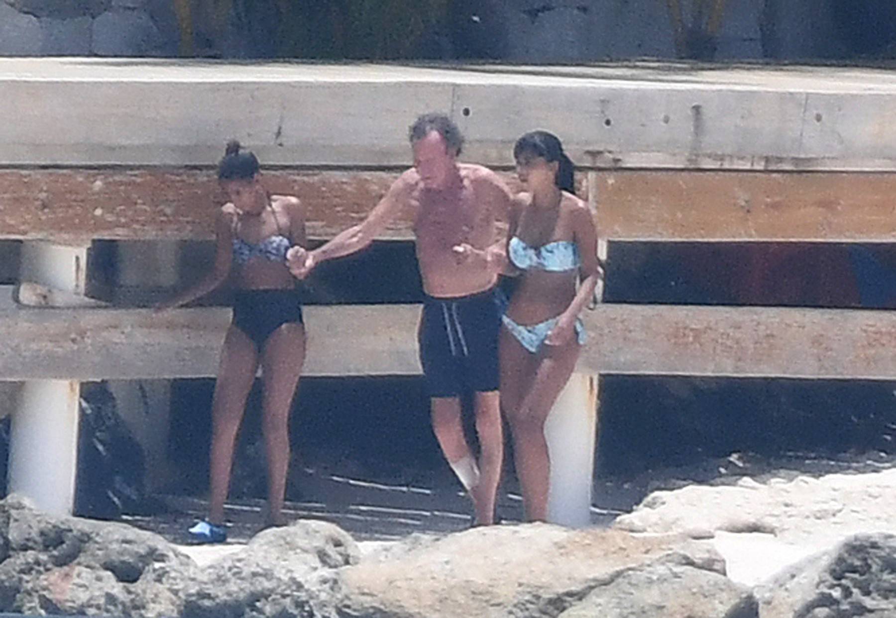 EXCLUSIVE: Julio Iglesias and two bikini-clad companions on the beach in front of his magnificent home in Punta Cana in the Dominican Republic