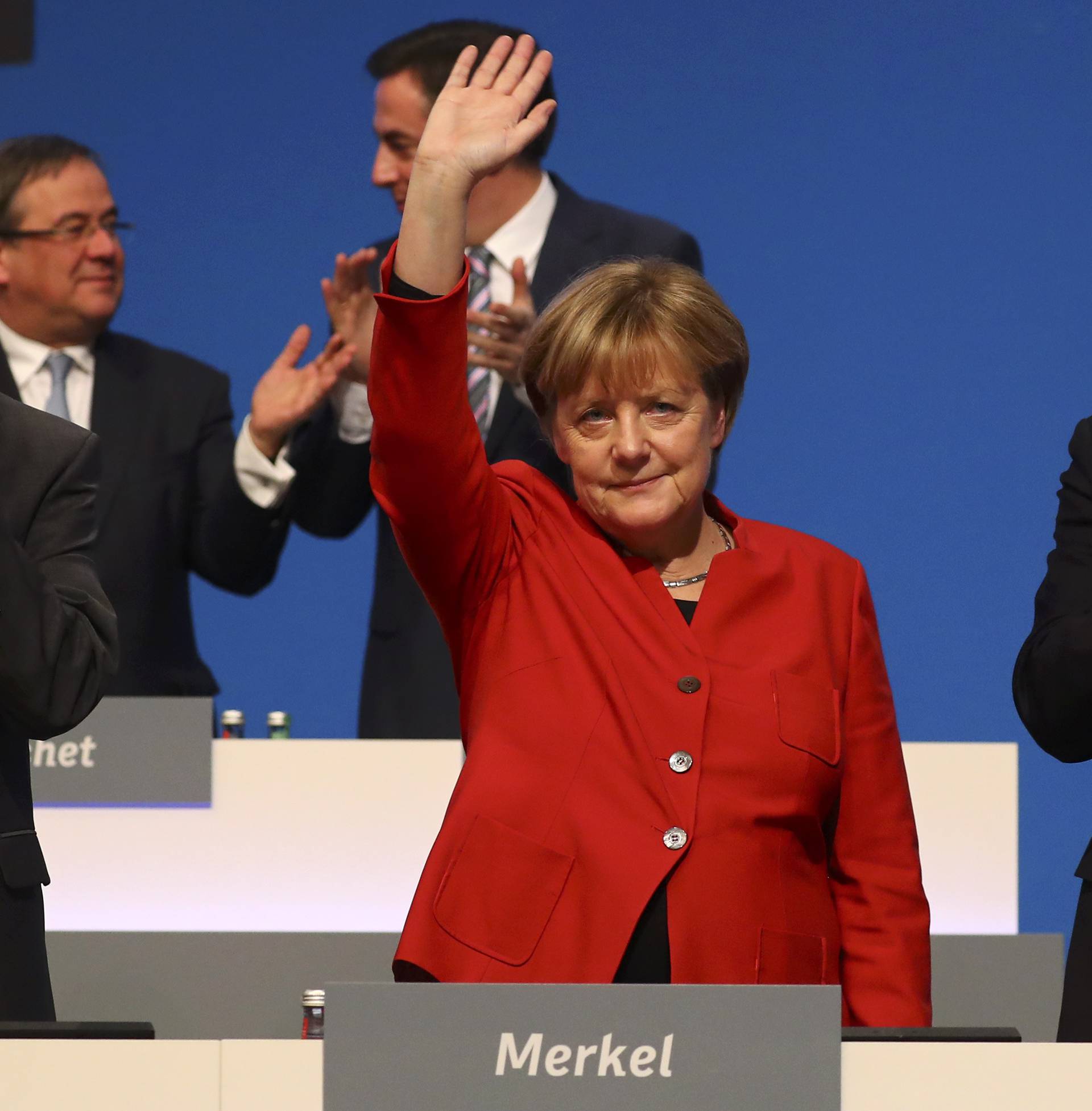 German Chancellor and leader of the conservative CDU Merkel waves after her speech at the CDU party convention in Essen