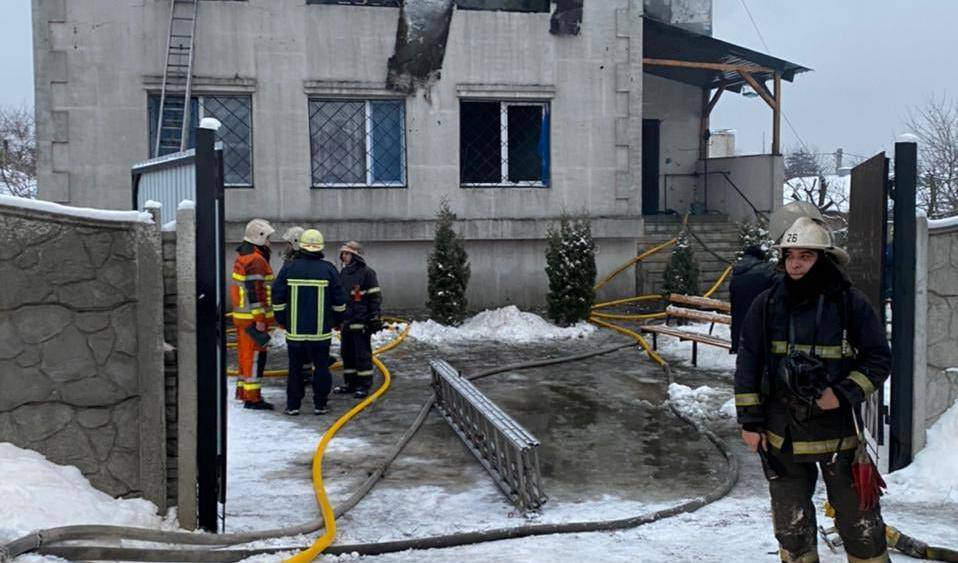 Rescuers work at the scene of the accident following a fire in nursing home in Kharkiv