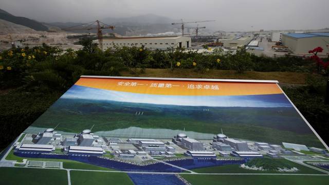 FILE PHOTO: An artist impression of Taishan Nuclear Power Plant is displayed on a viewing platform overlooking the construction site in Taishan, China