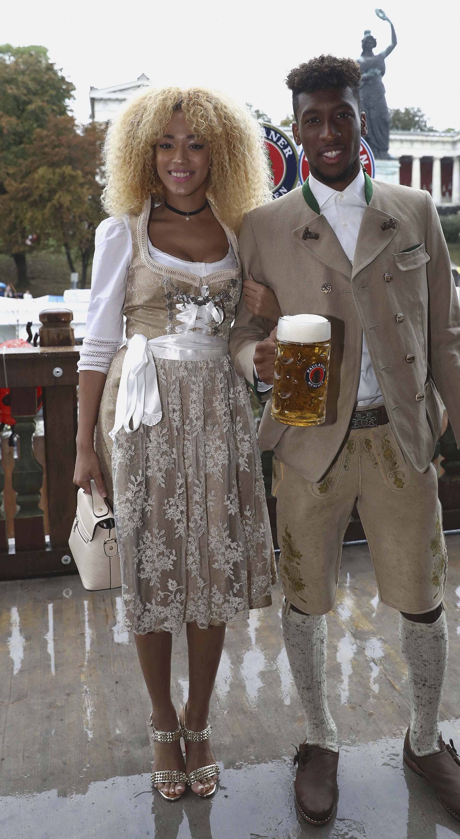 Coman of FC Bayern Munich and Sephora pose during their visit at the Oktoberfest in Munich