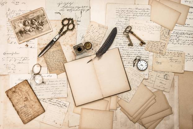 Old handwritten letters, pictures and antique writing accessories