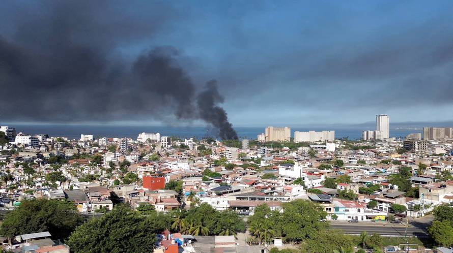 Smoke billows, following a military operation in which a government source said Mexican drug lord Nemesio Oseguera, known as "El Mencho," was killed, in Puerto Vallarta