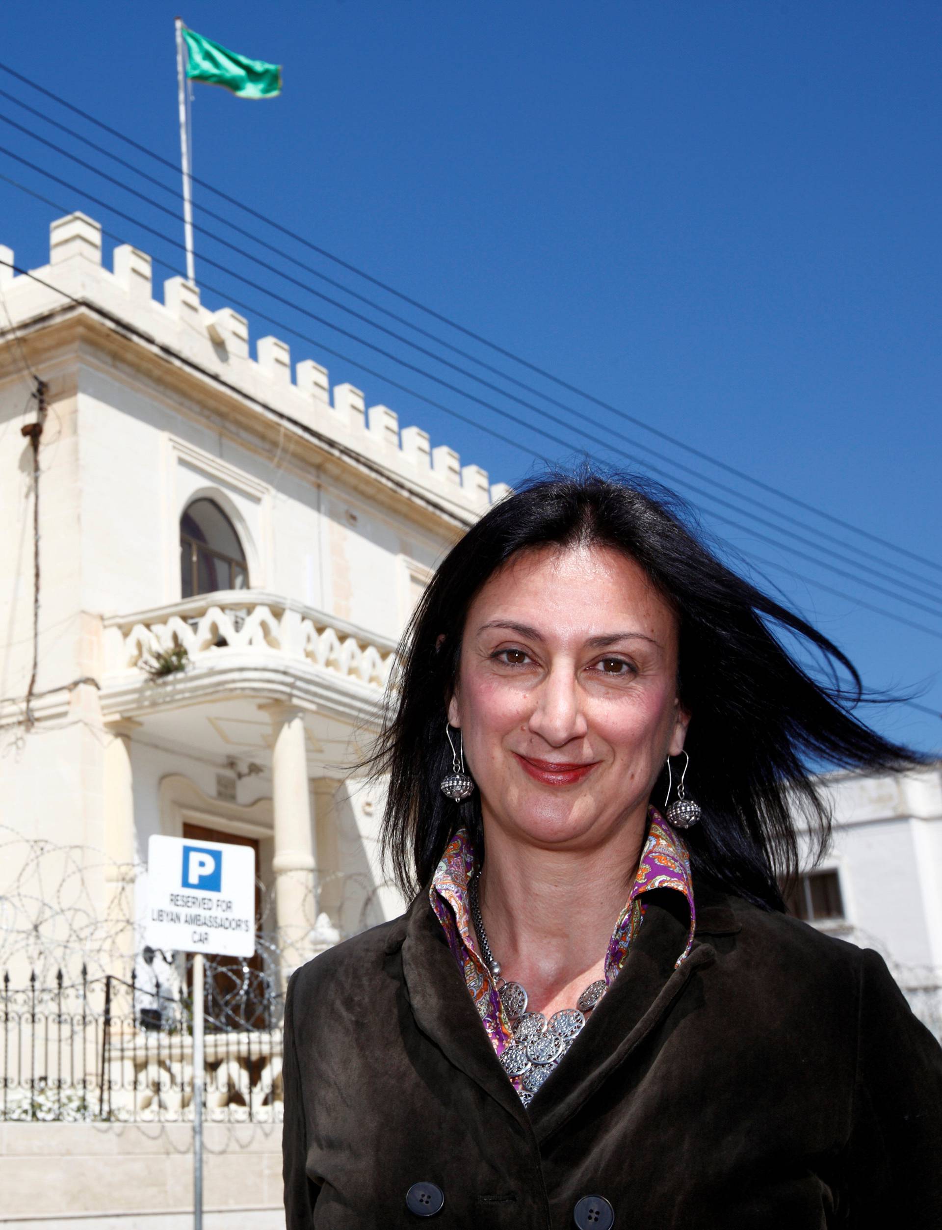 Maltese investigative journalist Daphne Caruana Galizia poses outside the Libyan Embassy in Valletta