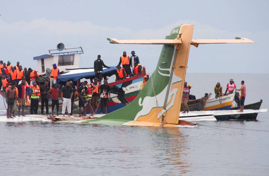 Rescuers attempt to recover the Precision Air passenger plane that crashed into Lake Victoria in Bukoba