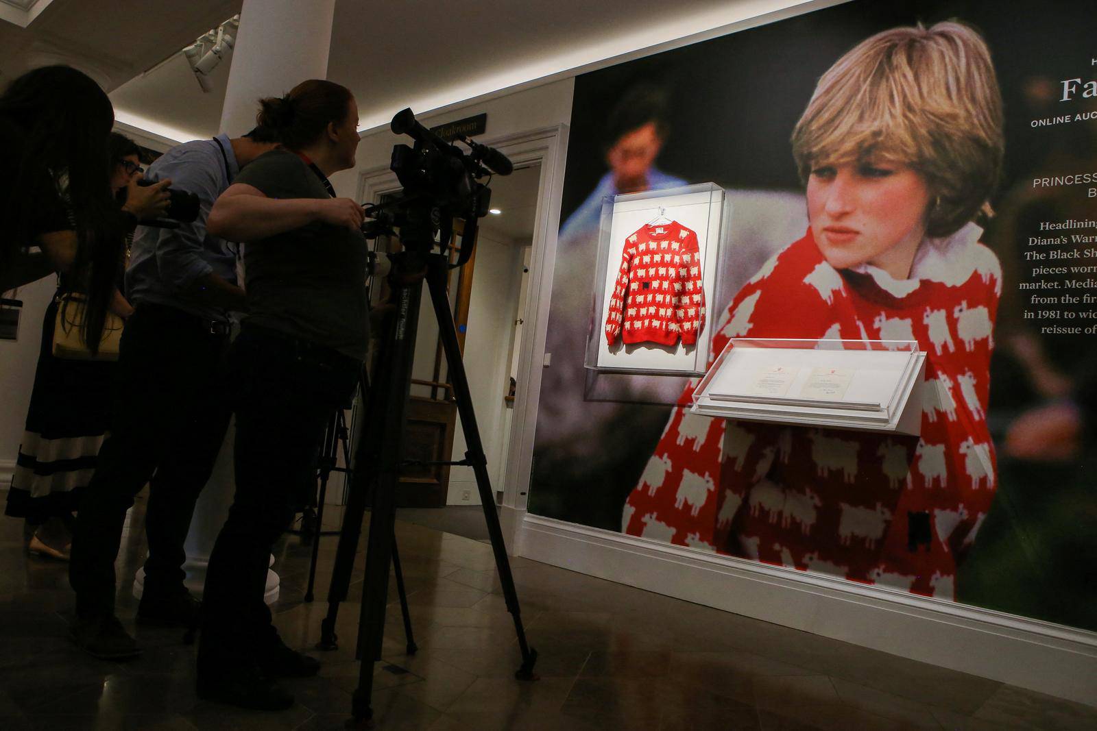 A 'black sheep' jumper worn by Britain's late Diana, Princess of Wales, goes up for auction at Sotheby's, in London