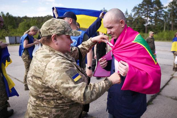 Ukrainian POWs are seen after a swap at an unknown location in Ukraine