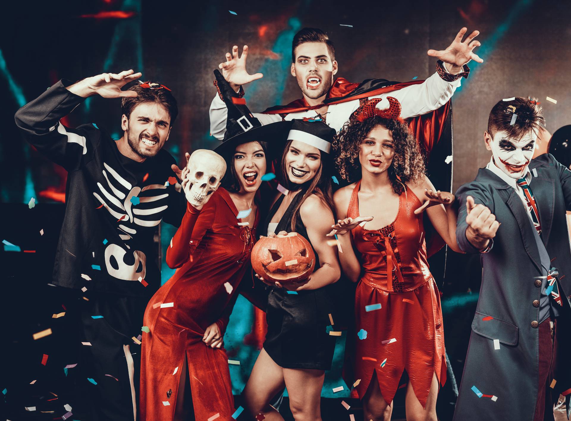 Portrait of Young Smiling People in Scary Costumes