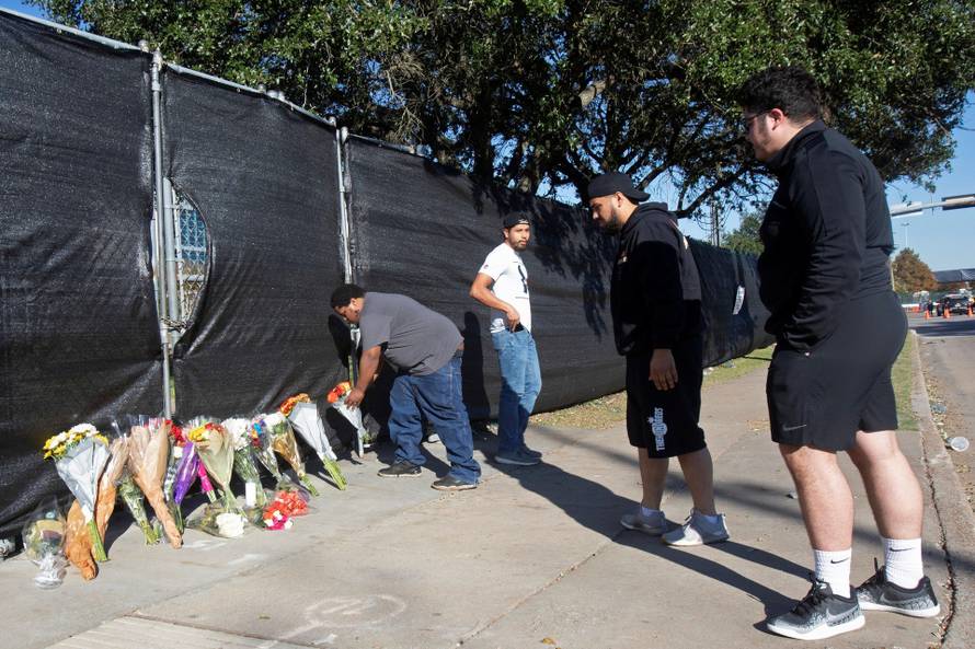 Flowers are left as a memorial to victims of the Astroworld Festival incident in Houston