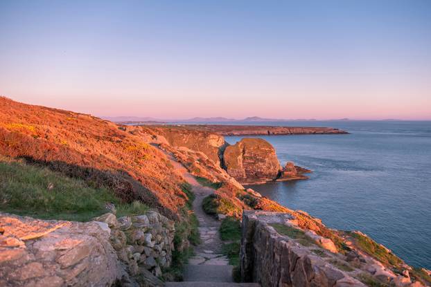 Sunset at the cliffs by the south stack lighthouse on Anglesey in Wales