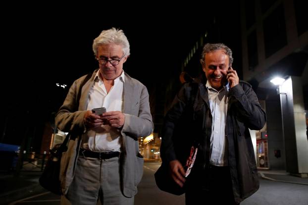 Former head of European football association UEFA Michel Platini and his lawyer William Bourdon leave a judicial police station where Platini was detained for questioning over the awarding of the 2022 World Cup soccer tournament, in Nanterre