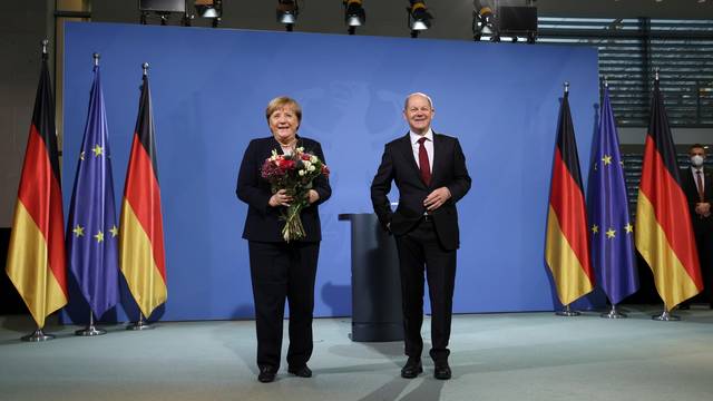 Former German Chancellor Merkel bids farewell to her successor Scholz in Berlin