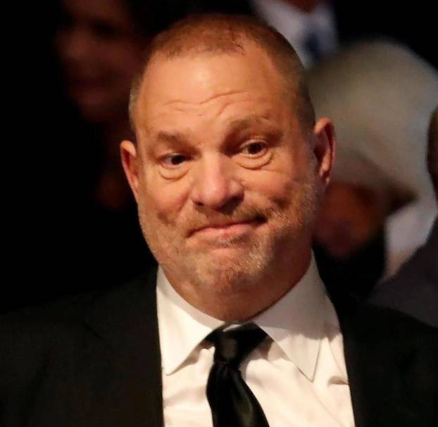 FILE PHOTO: Producer Weinstein stands in the audience ahead of the first presidential debate between U.S. presidential nominee Donald trump and U.S. presidential nominee Clinton in Hempstead