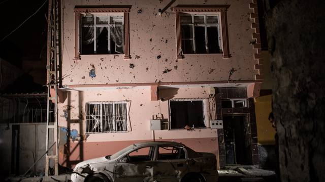 A building which was hit by rockets fired from Syria, is seen in the Turkish border town of Kilis