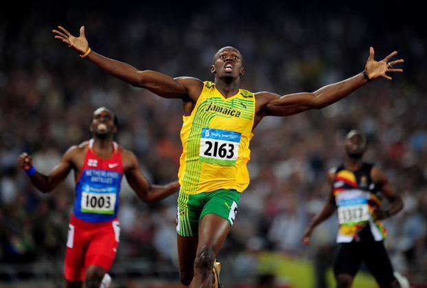 FILE PHOTO: Usain Bolt of Jamaica celebrates winning men