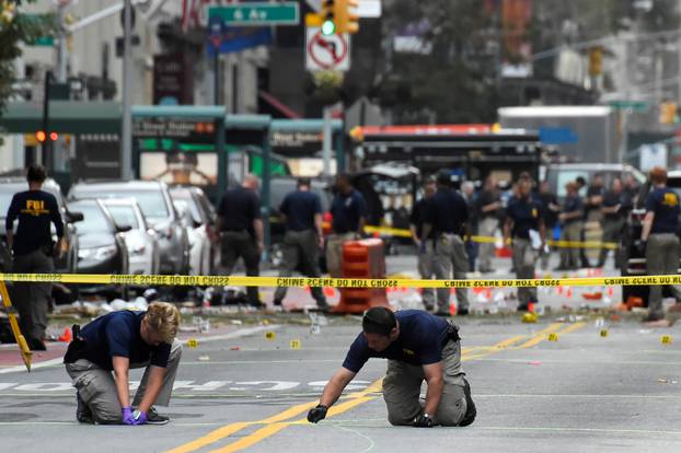 FBI officials mark ground near site of explosion in New York