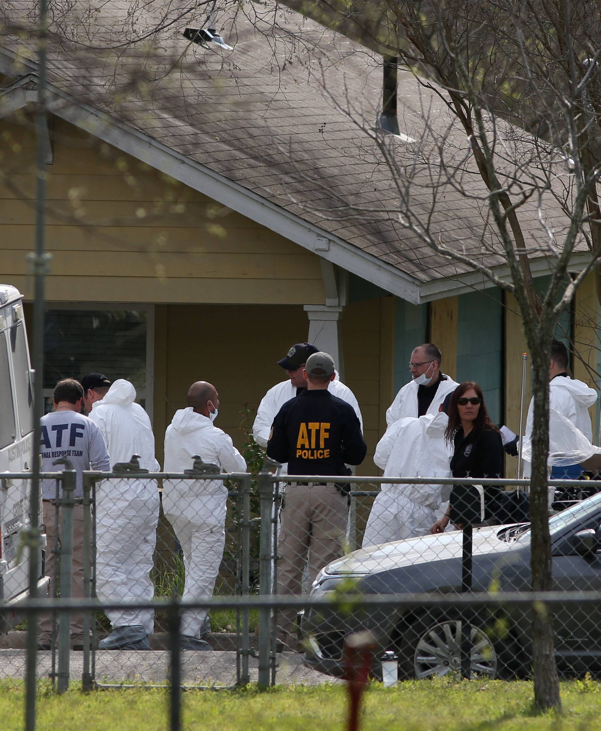 Law enforcement personnel investigate the home where Austin serial bomber Mark Anthony Conditt lived in Pflugerville