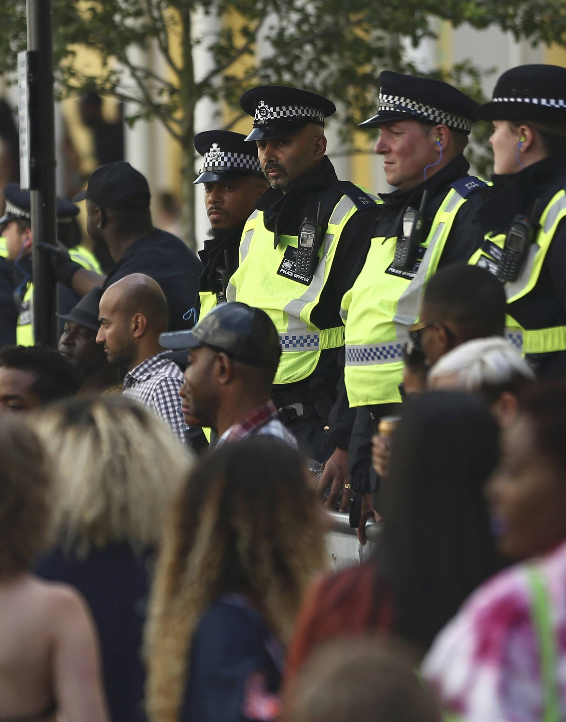 Police keep watch at the Notting Hill Carnival in London