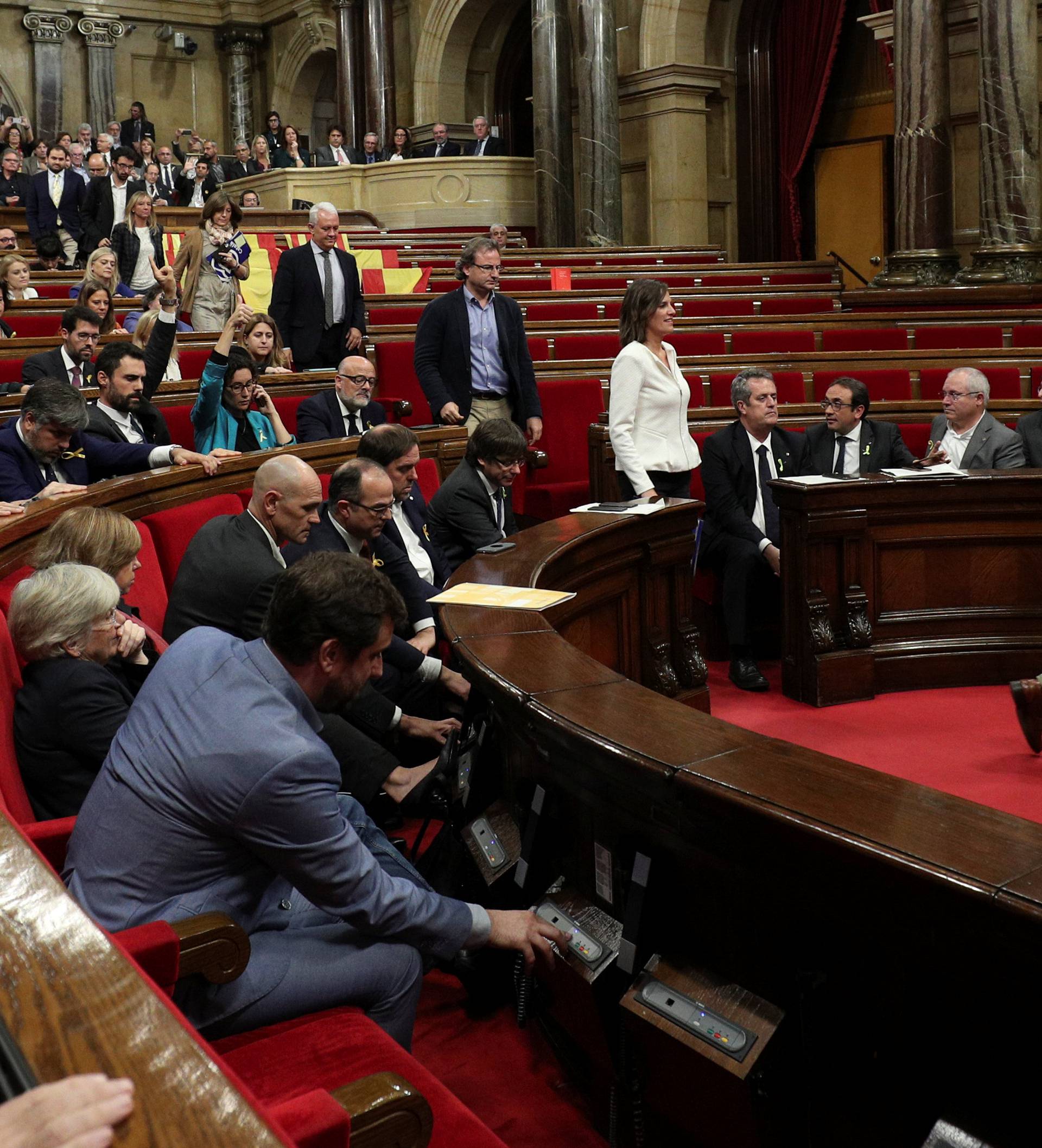 Deputies from Popular Party (PP) abandon the chamber during a plenary session at the Catalan regional Parliament in Barcelona