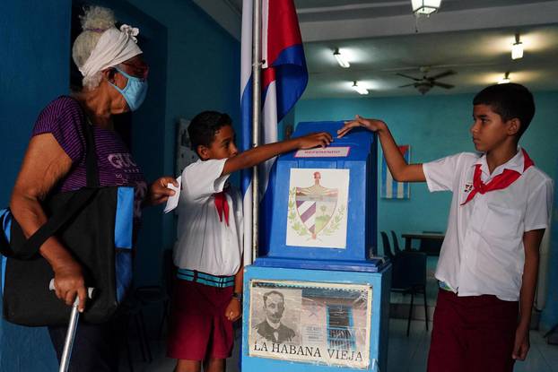 People vote during the new Family Code referendum, in Havana